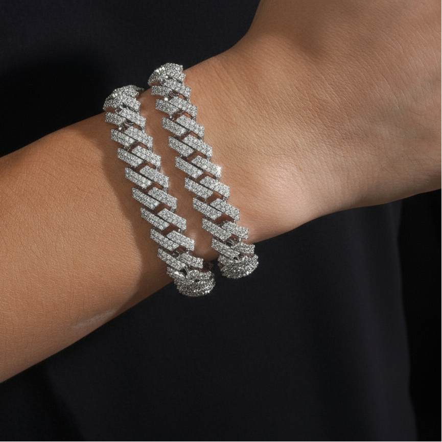 Two bracelets on arm, black background